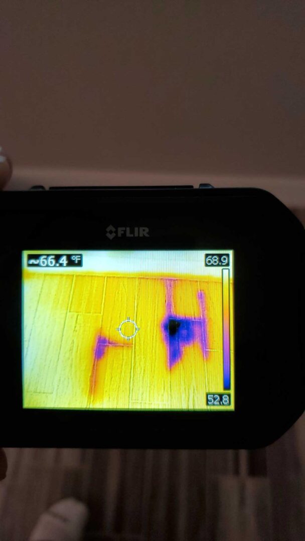 Thermal imaging camera used to check for hidden moisture in a wall